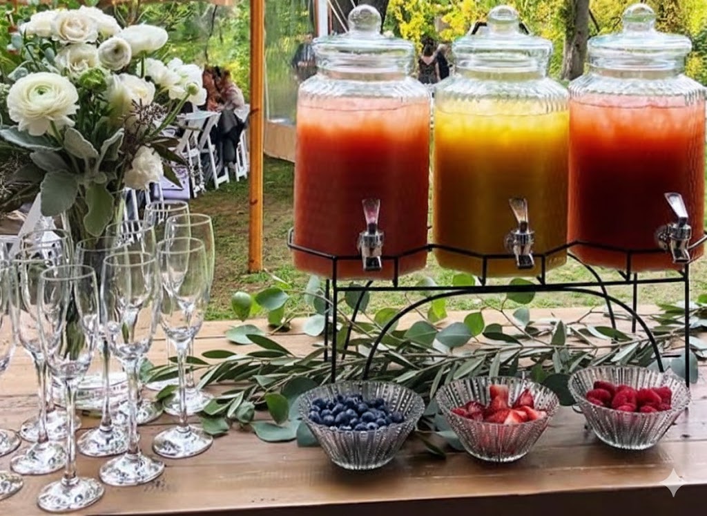 baby shower bar with fresh fruits olive branches cream ranunculus and organized juice stations