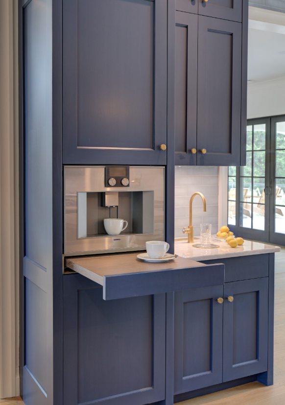 Navy blue coffee bar with pull-out serving tray and built-in espresso machine